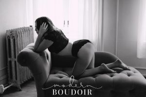 Woman posing on couch for boudoir photography